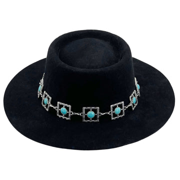 Black Frame – Teal Glyph