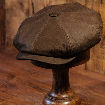 Eight Piece Brown Leather Newsboy Cap